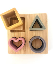 Load image into Gallery viewer, 4 in 1 Teething Puzzle Colours and Shapes Set | Montessori Developmental Toy | Learn Colours Shapes | Natural Timber Base and Food Grade Silicone | Dishwasher Safe Shapes
